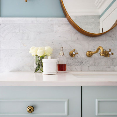 Example of a classic gray tile and marble tile marble floor drop-in bathtub design in Sydney with shaker cabinets, green cabinets, an undermount sink, marble countertops and white countertops