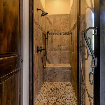 Master shower in tuscan home