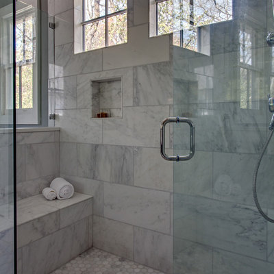 Inspiration for a large rustic master white tile marble floor freestanding bathtub remodel in Nashville with an undermount sink, recessed-panel cabinets and dark wood cabinets