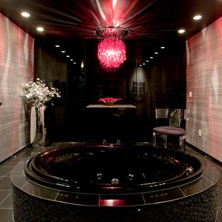 Drop-in bathtub - contemporary gray tile drop-in bathtub idea in Seattle with a vessel sink