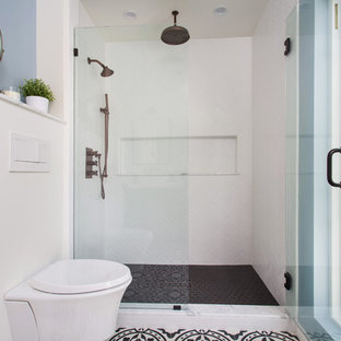 Example of a mid-sized danish 3/4 white tile and porcelain tile cement tile floor and black floor alcove shower design in Los Angeles with furniture-like cabinets, black cabinets, a wall-mount toilet, gray walls, an undermount sink, marble countertops and a hinged shower door
