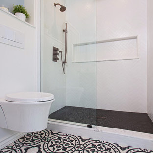 Alcove shower - mid-sized scandinavian 3/4 white tile and porcelain tile cement tile floor and black floor alcove shower idea in Los Angeles with furniture-like cabinets, black cabinets, a wall-mount toilet, gray walls, an undermount sink, marble countertops and a hinged shower door