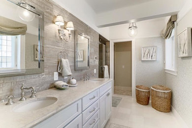 Inspiration for a large timeless master gray tile and porcelain tile marble floor alcove shower remodel in New York with recessed-panel cabinets, white cabinets, marble countertops, gray walls and an undermount sink