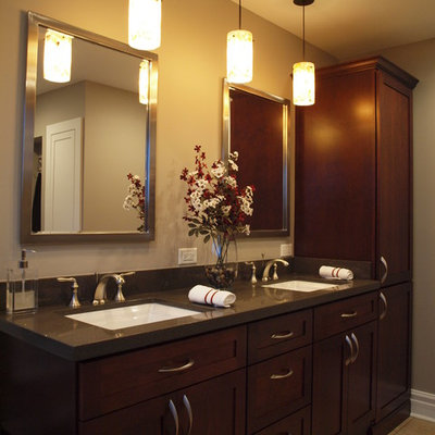 Example of a mid-sized classic master bathroom design in Chicago with an undermount sink, shaker cabinets, dark wood cabinets, quartz countertops and beige walls