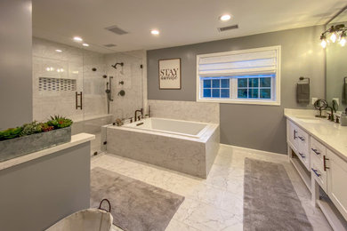 Inspiration for a huge master white tile and porcelain tile porcelain tile, white floor and double-sink bathroom remodel in Bridgeport with shaker cabinets, white cabinets, a two-piece toilet, gray walls, an undermount sink, quartz countertops, a hinged shower door, white countertops and a freestanding vanity