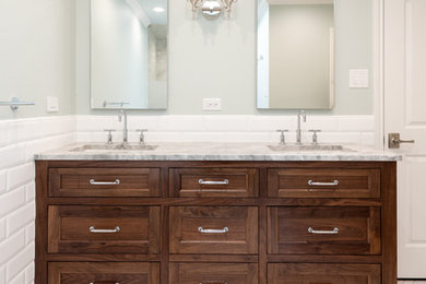 Example of a mid-sized transitional master white tile and subway tile porcelain tile and white floor freestanding bathtub design in Dallas with shaker cabinets, medium tone wood cabinets, blue walls, an undermount sink, quartzite countertops and gray countertops