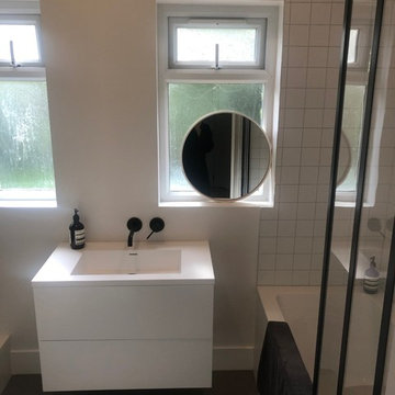 matt white 10 x 10 tiles with black bathroom fittingsb