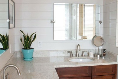 Inspiration for a mid-sized coastal master bathroom remodel in Columbus with shaker cabinets, medium tone wood cabinets, white walls and an undermount sink