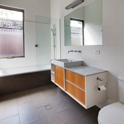 Example of a mid-sized trendy white tile porcelain tile bathroom design in Perth with a vessel sink, marble countertops, a two-piece toilet, white walls, flat-panel cabinets and medium tone wood cabinets
