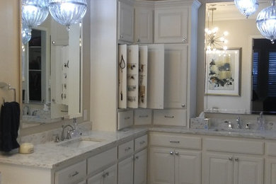 Inspiration for a large transitional master white tile and marble tile marble floor and gray floor bathroom remodel in Dallas with raised-panel cabinets, white cabinets, quartzite countertops, beige walls, an undermount sink and a hinged shower door