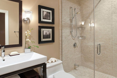 Alcove shower - mid-sized transitional master beige tile alcove shower idea in Dallas with a vessel sink, dark wood cabinets, a two-piece toilet, beige walls and flat-panel cabinets