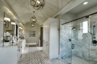Alcove shower - large transitional master gray tile, white tile and stone slab marble floor alcove shower idea in Austin with shaker cabinets, white cabinets, gray walls, an undermount sink and granite countertops