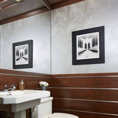 Tuscan brown floor bathroom photo in Minneapolis with a one-piece toilet, gray walls and a pedestal sink