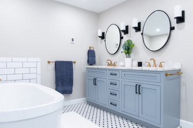 Mid-sized minimalist master white tile and ceramic tile ceramic tile, black floor and double-sink bathroom photo in Boston with blue cabinets, beige walls, white countertops, a niche and a built-in vanity