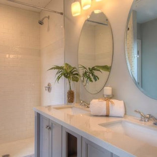 Example of a mid-sized transitional 3/4 white tile and subway tile medium tone wood floor and brown floor bathroom design in Boston with recessed-panel cabinets, gray cabinets, gray walls, an undermount sink, quartz countertops and white countertops