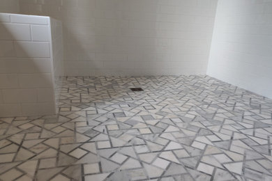 Example of a mid-sized trendy master marble floor and gray floor alcove shower design in Minneapolis