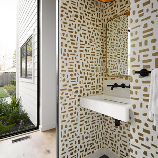 Small minimalist 3/4 white tile porcelain tile, gray floor, single-sink and wallpaper ceiling bathroom photo in San Francisco with white cabinets, a one-piece toilet, white walls, a wall-mount sink, white countertops and a floating vanity