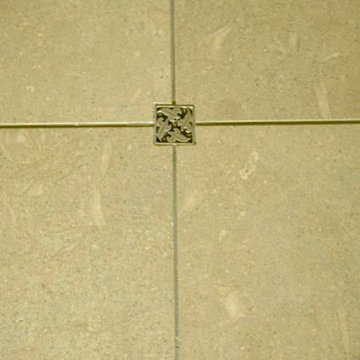Metal tile accent in shower