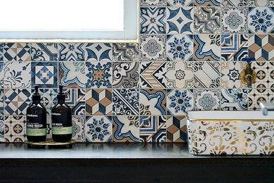 Bathroom - mid-sized industrial multicolored tile and ceramic tile bathroom idea in Perth with open cabinets, a console sink and solid surface countertops