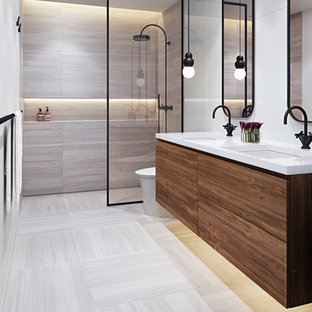 Walk-in shower - small transitional gray tile and marble tile marble floor and gray floor walk-in shower idea in Miami with flat-panel cabinets, medium tone wood cabinets, a one-piece toilet, white walls, an undermount sink, quartz countertops and a floating vanity