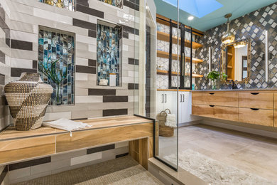 Inspiration for a huge mid-century modern master multicolored tile concrete floor and white floor alcove shower remodel in Manchester with light wood cabinets, yellow walls, an undermount sink, quartz countertops, a hinged shower door and beige countertops