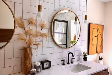 Bathroom - mid-sized modern master white tile and subway tile bathroom idea in Grand Rapids with flat-panel cabinets, medium tone wood cabinets, white walls, an undermount sink, marble countertops and white countertops