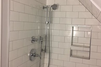 Inspiration for a mid-sized transitional 3/4 white tile and subway tile alcove shower remodel in Other with white walls