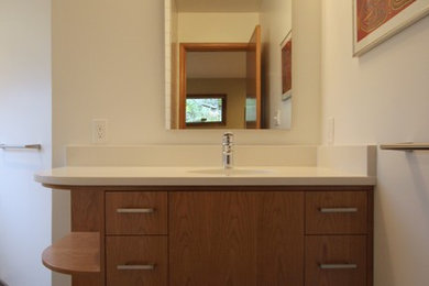 Example of a 1950s bathroom design in Portland with quartzite countertops