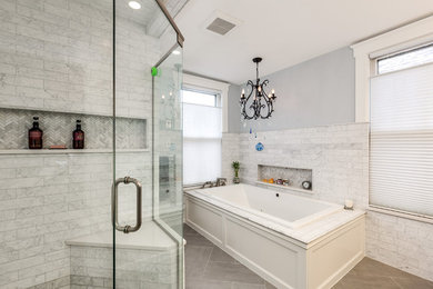 Large transitional master gray tile, white tile and marble tile porcelain tile and brown floor bathroom photo in Detroit with a hinged shower door and gray walls