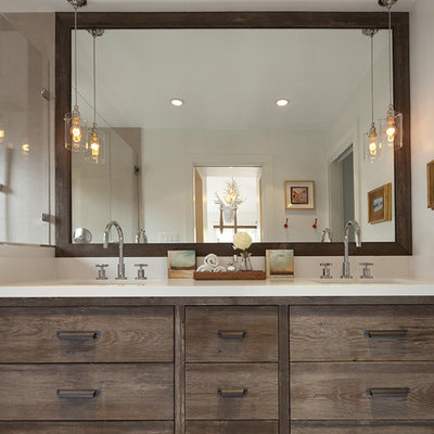 Mountain style beige tile bathroom photo in San Francisco with an undermount sink, flat-panel cabinets and dark wood cabinets