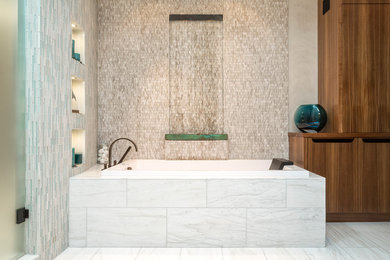 Inspiration for a large contemporary master beige tile and stone tile marble floor and gray floor drop-in bathtub remodel in San Francisco with flat-panel cabinets, medium tone wood cabinets and beige walls