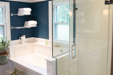 Inspiration for a mid-sized timeless master white tile and stone slab dark wood floor bathroom remodel in New York with blue walls, recessed-panel cabinets, white cabinets and an undermount sink