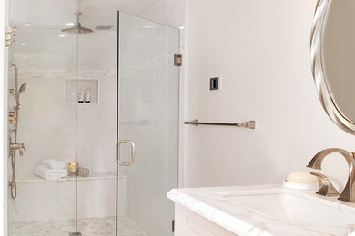 Photo of a large traditional ensuite bathroom in Toronto with a submerged sink, freestanding cabinets, light wood cabinets, marble worktops, a double shower, a two-piece toilet, white tiles, porcelain tiles, grey walls and porcelain flooring.