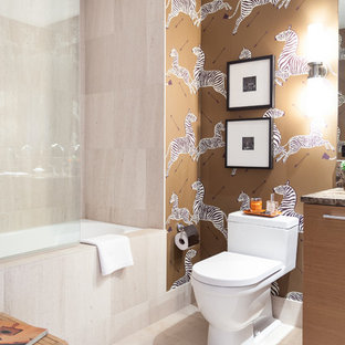 Design ideas for a small contemporary master bathroom in San Francisco with an undermount sink, flat-panel cabinets, medium wood cabinets, marble benchtops, an alcove tub, a shower/bathtub combo, a one-piece toilet, beige tile, stone tile, multi-coloured walls and limestone floors.