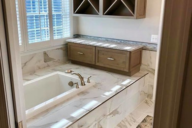 Inspiration for a mid-sized transitional master white tile and porcelain tile porcelain tile and multicolored floor bathroom remodel in Baltimore with recessed-panel cabinets, medium tone wood cabinets, a one-piece toilet, gray walls, an undermount sink, a hinged shower door and gray countertops