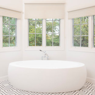 Inspiration for a large contemporary master bathroom in New York with flat-panel cabinets, beige cabinets, a double shower, a two-piece toilet, white tile, mirror tile, white walls, mosaic tile floors, a vessel sink, engineered quartz benchtops, white floor, a hinged shower door, white benchtops, a shower seat, a single vanity, a floating vanity and vaulted.