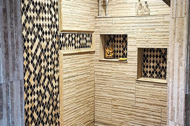Inspiration for a large mediterranean master beige tile and stone tile corner shower remodel in Austin