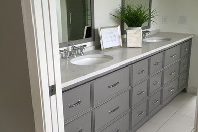 Inspiration for a large contemporary master bathroom remodel in Minneapolis with furniture-like cabinets and gray cabinets