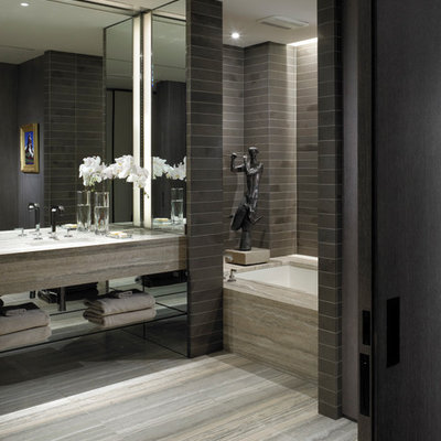 Minimalist gray tile bathroom photo in New York with black walls