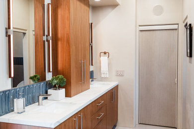 Large transitional master gray tile and porcelain tile porcelain tile and gray floor bathroom photo in San Diego with flat-panel cabinets, medium tone wood cabinets, a bidet, gray walls, an undermount sink, quartz countertops, a hinged shower door and white countertops