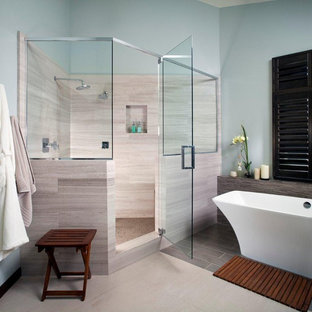 Example of a large trendy master beige tile and stone tile ceramic tile and beige floor bathroom design in San Diego with blue walls, furniture-like cabinets, dark wood cabinets, a hinged shower door, a two-piece toilet, a vessel sink and quartz countertops