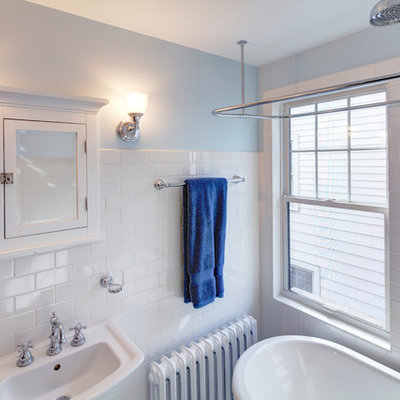 Example of a small arts and crafts white tile and subway tile bathroom design in Other with a pedestal sink, a two-piece toilet and blue walls