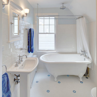 Small arts and crafts white tile and subway tile mosaic tile floor bathroom photo in Other with a pedestal sink, a two-piece toilet and blue walls