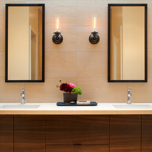 Trendy bathroom photo in San Francisco with an undermount sink, flat-panel cabinets and dark wood cabinets