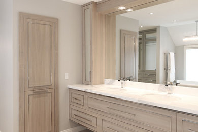 Example of a large trendy master gray tile and marble tile porcelain tile and beige floor bathroom design in Calgary with beaded inset cabinets, light wood cabinets, gray walls, an undermount sink, quartz countertops and a hinged shower door