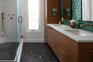 Inspiration for a mid-sized modern master green tile and ceramic tile black floor and double-sink corner shower remodel in Denver with flat-panel cabinets, medium tone wood cabinets, an undermount sink, quartz countertops, a hinged shower door, white countertops, a niche and a floating vanity