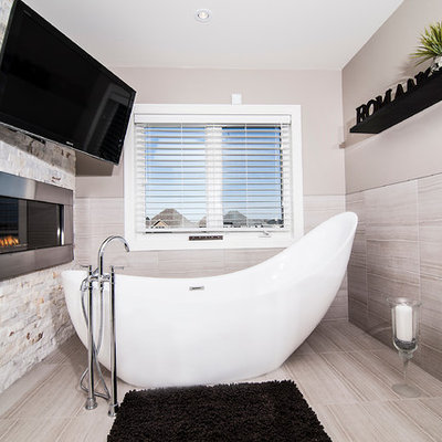 Example of a trendy freestanding bathtub design in Toronto