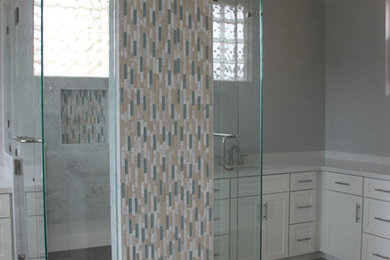 Bathroom - coastal multicolored tile and mosaic tile multicolored floor bathroom idea in San Diego with white cabinets, a hot tub, a one-piece toilet, an undermount sink, granite countertops and white countertops
