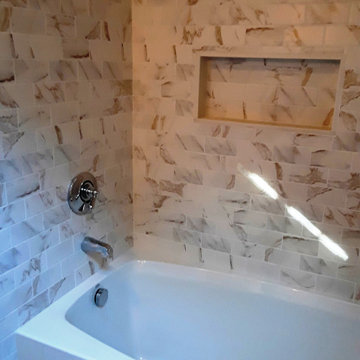 Moderately priced bath remodel with soaking tub and shower combination.