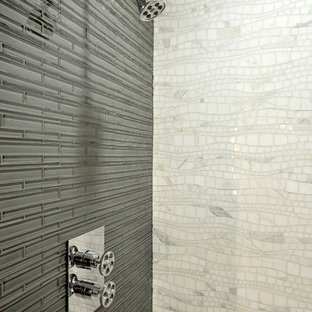 Minimalist gray tile and glass tile bathroom photo in New York with a wall-mount sink, flat-panel cabinets, dark wood cabinets and gray walls